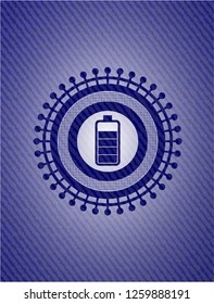 battery icon inside jean or denim emblem or badge background