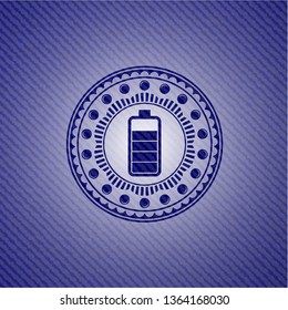 battery icon inside jean or denim emblem or badge background
