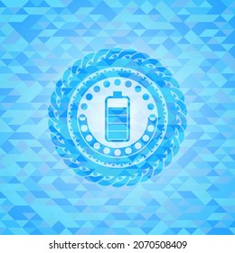battery icon inside realistic sky blue emblem. Mosaic background. 