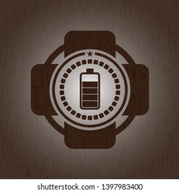 battery icon inside retro style wooden emblem