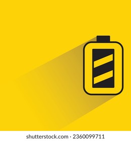 battery with shadow on yellow background