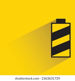 battery with shadow on yellow background