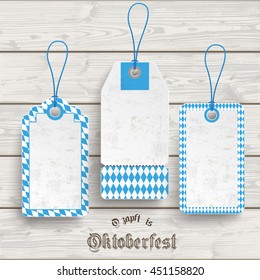 Bavarian sale stickers on the grey background. German text "Ozapft is" and "Oktoberfest", translate "on tap" and "Oktoberfest". Eps 10 vector file.