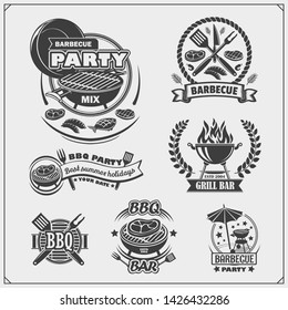 BBQ and grill labels set. Barbecue emblems, badges and design elements. Vector monochrome illustration.