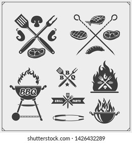 BBQ and grill labels set. Barbecue emblems, badges and design elements. Vector monochrome illustration.