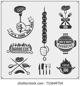 BBQ and grill labels set. Barbecue emblems, badges and design elements. Vector monochrome illustration.