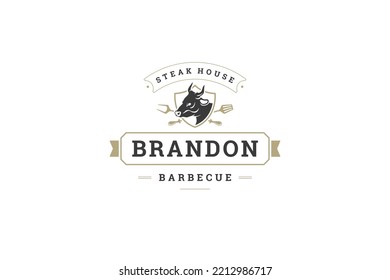 BBQ steak cafe vintage logo design template cow head in heraldic shield with crossed cutlery vector illustration. Barbecue grill restaurant fresh beef meat cooking gourmet menu marketing emblem