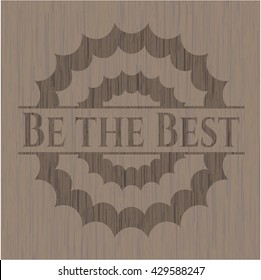 Be the Best badge with wooden background