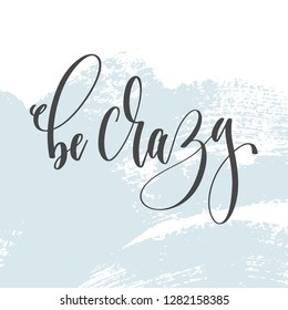 be crazy - hand lettering inscription text on light blue brush stroke background, calligraphy vector illustration