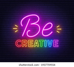 Be creative neon inspirational quote on a brick wall.