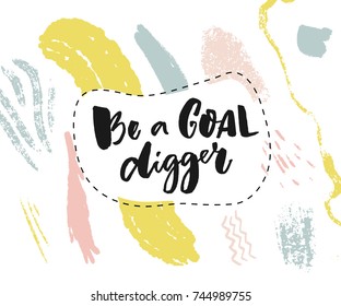 Be a goal digger. Motivational saying for posters and social media. Black brush lettering on abstract paint stains