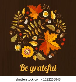 Be grateful Thanksgiven greeting card. Colorfull fallen leaves, berries and mushrooms at dark wood background. Template for autumn design