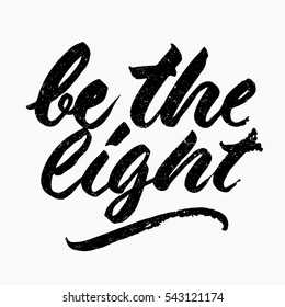 Be the light quote. Ink hand lettering. Modern brush calligraphy. Handwritten phrase. Inspiration graphic design typography element. Cute simple vector sign.