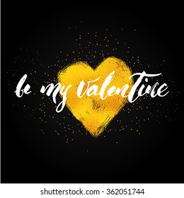 be my Valentine hand lettering - hand made calligraphy in modern style. Write with brush. Text over heart shape with gold foil texture. Black background