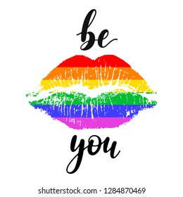 Be you - black handwritten lettering with lip imprint in colors of  LGBT rainbow flag isolated on white background. Modern vector design, decorative inscription, motivational poster.