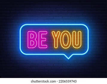 Be You neon sign in the speech bubble on brick wall background.