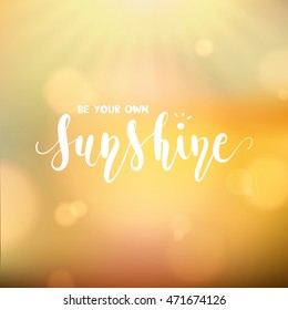 Be your own sunshine lettering , an inspirational quote with modern calligraphy on sun ray and bright bokeh background for motivation card or poster in vector illustration EPS10