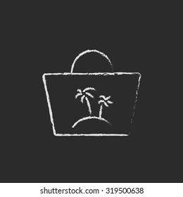 Beach bag hand drawn in chalk on a blackboard vector white icon isolated on a black background.