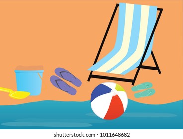 Beach chair, flip flops, inflatable ball, bucket and spoon near the sea