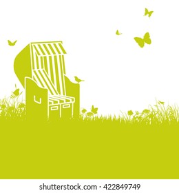 Beach chair in the sun and grass