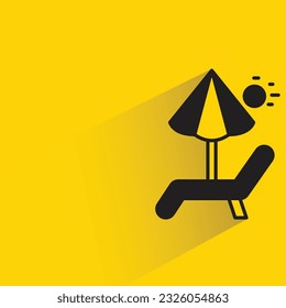 beach chair and umbrella with shadow on yellow background