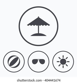 Beach holidays icons. Ball, umbrella and sunglasses signs. Summer sun symbol. Icons in circles.