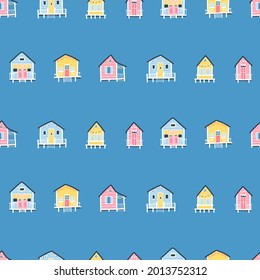 Beach houses seamless pattern. Cute summer cartoon illustrations in simple hand drawn childish scandinavian style. Tiny tropical buildings in a colorful pastel palette. Ideal for printing