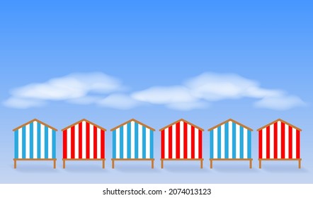 Beach huts on the seacoast. Color beach cabins on the seashore. Summer striped bungalows