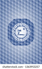 beach icon inside blue badge with geometric pattern.