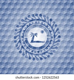 beach icon inside blue emblem with geometric background.