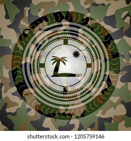 beach icon inside camouflaged emblem