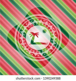 beach icon inside christmas colors badge.