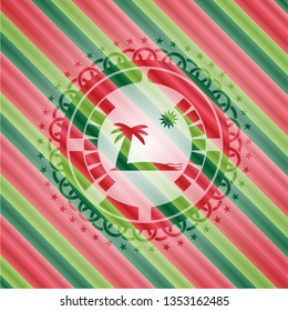 beach icon inside christmas emblem.