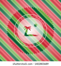 beach icon inside christmas emblem.