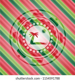 beach icon inside christmas style badge..