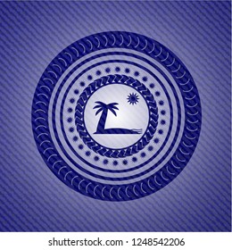 beach icon inside emblem with denim high quality background
