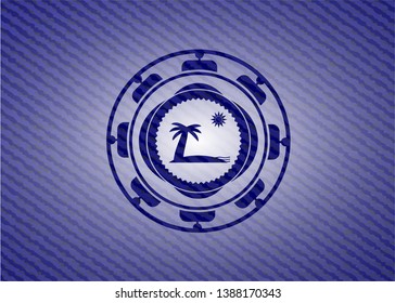 beach icon inside emblem with denim texture
