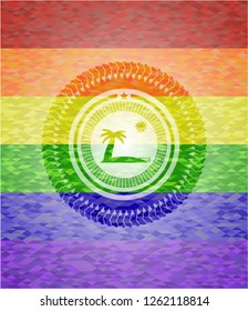 beach icon inside emblem on mosaic background with the colors of the LGBT flag
