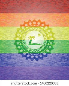 beach icon inside emblem on mosaic background with the colors of the LGBT flag