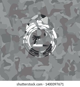 beach icon inside grey camo emblem