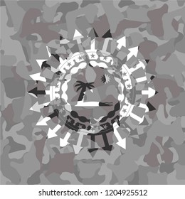 beach icon inside grey camouflage emblem