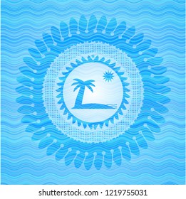 beach icon inside light blue water badge background.