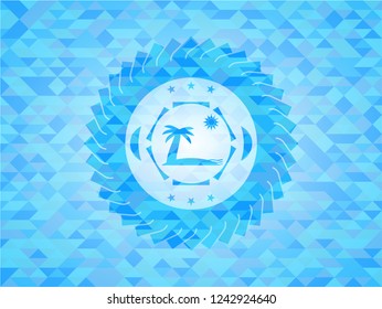 beach icon inside light blue mosaic emblem