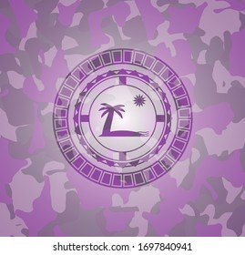 beach icon inside pink and purple camouflaged emblem