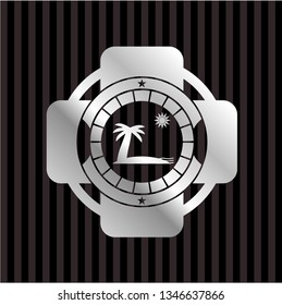 beach icon inside silver emblem