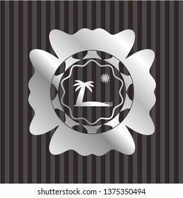beach icon inside silver emblem or badge