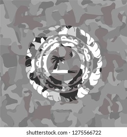 beach icon on grey camouflage texture