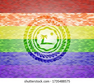 icono de playa sobre fondo de mosaico con los colores de la bandera LGBT. 