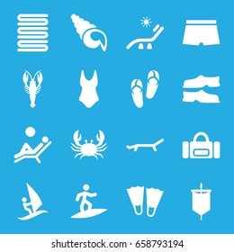 Beach icons set. set of 16 beach filled icons such as crab, flip flops, sunbed, towels, slippers, man laying in the sun, man swim wear, shell, surfing, sail, flippers