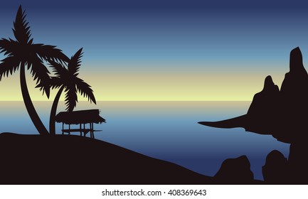 Beach at morning scenery with hut and palm